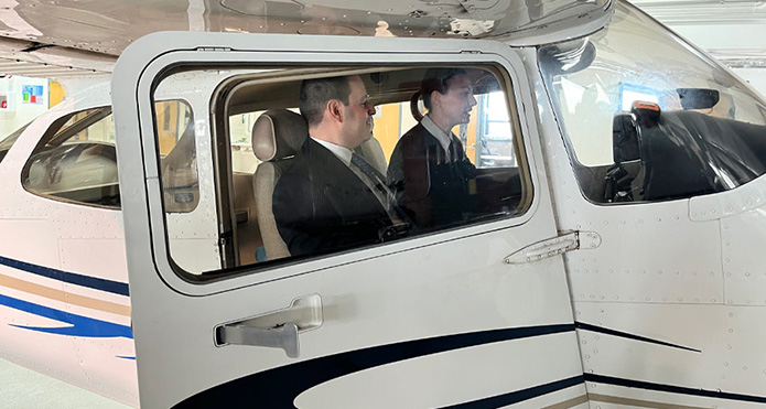 Demitrios Nicolaides, PhD, minister of advanced education and Ashleigh Morrow, second-year MRU aviation student.