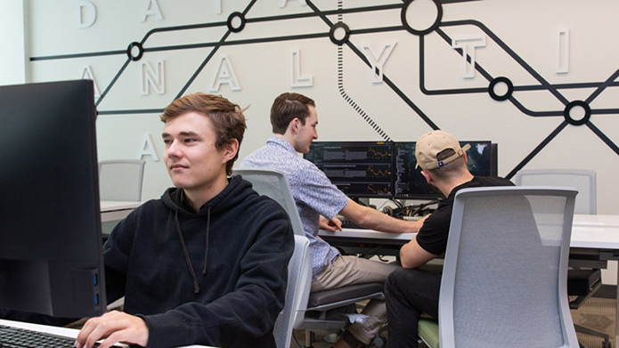 Students and a professor in the CN Supply Chain Analytics lab.