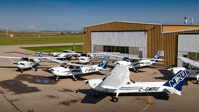 MRU airplanes sitting outside the hangar.