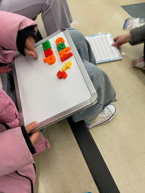 Manipulative letters and gems to segment each sound and letter