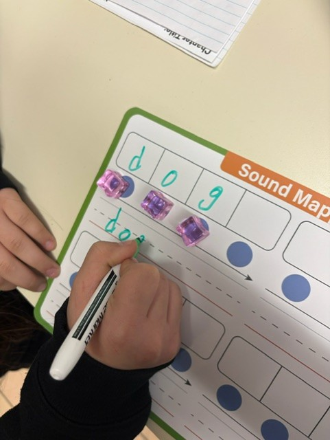 Manipulative letters and gems to segment each sound and letter