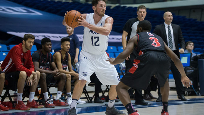 Noah Lewis representing the Cougars’ men's basketball team.