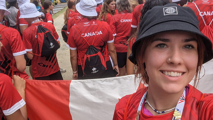 Emily Metituk walking in the opening ceremonies for the Youth Commonwealth Games with Team Canada.