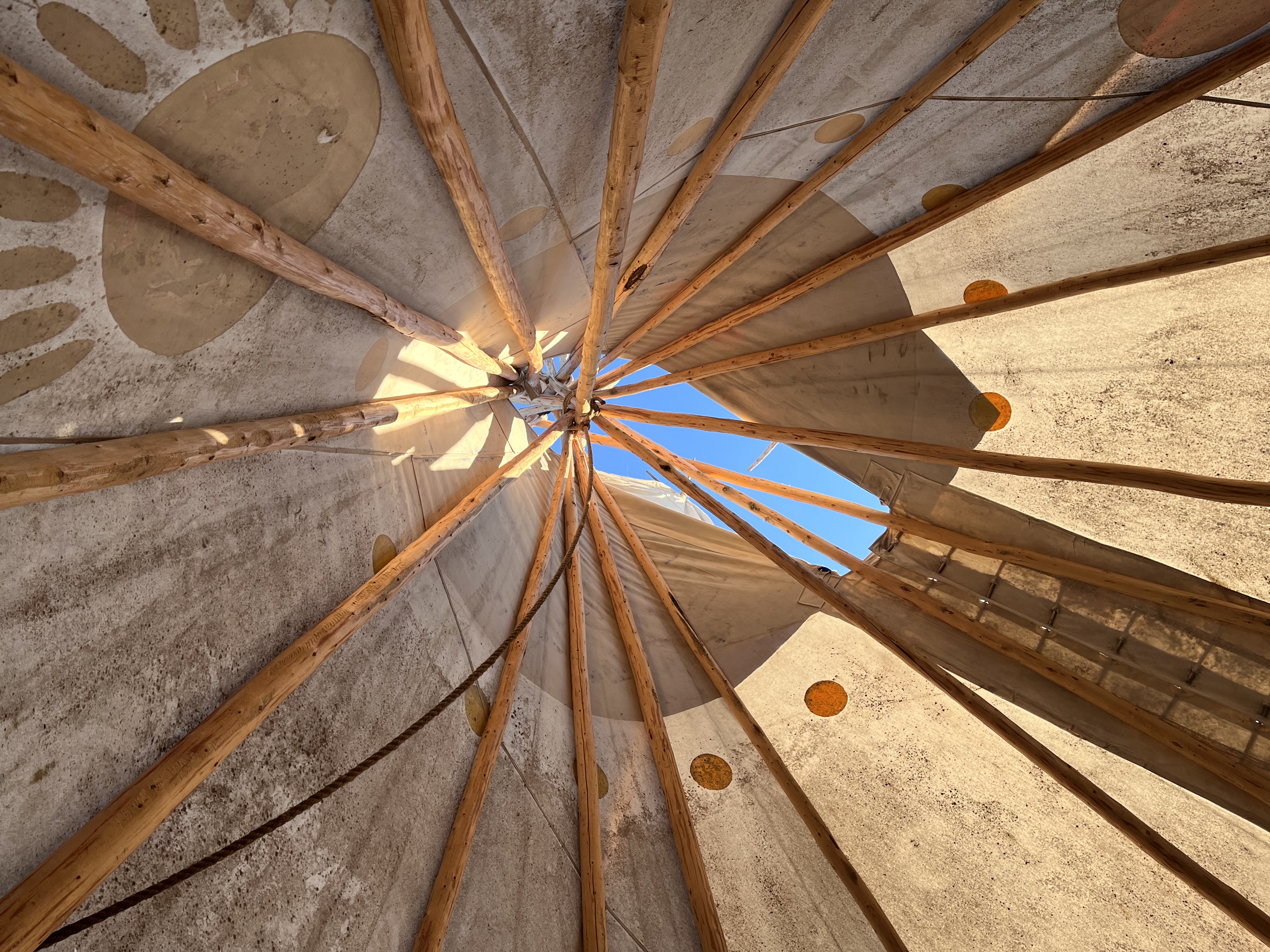 The inside of a tipi where the poles join at the top.