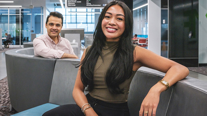 Dr. Khosro Salmani, PhD and BCIS student Alyssa Landeta pose for a photo in the Riddell Library and Learning Centre