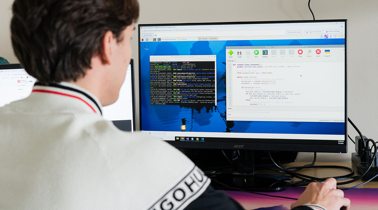 MRU alum Benjamin Rudolph coding at his home office.