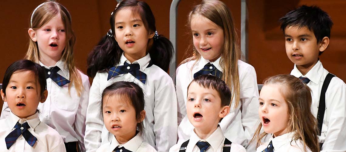 A group of children singing in a choir.