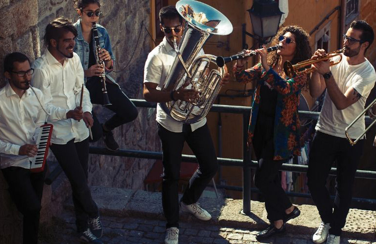 A band playing music out on a street.