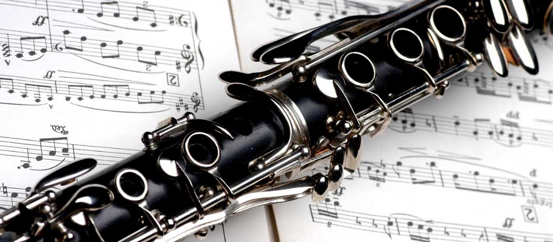 Close up of a clarinet on sheet music