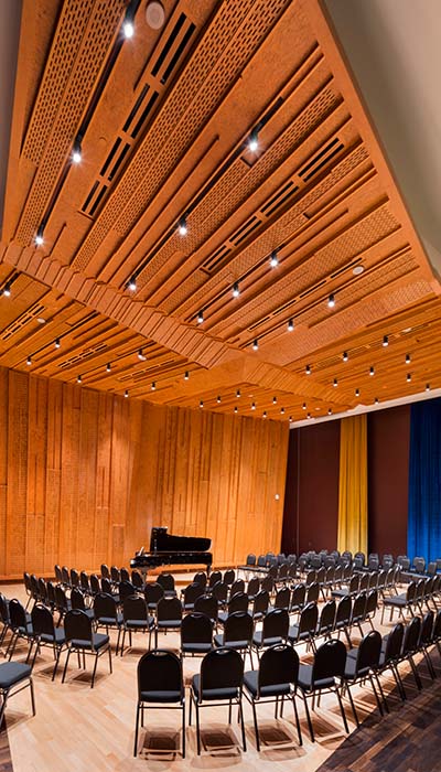 Rows of seating around a grand piano in the TransAlta Pavillion in the Taylor Centre for the Performing Arts.