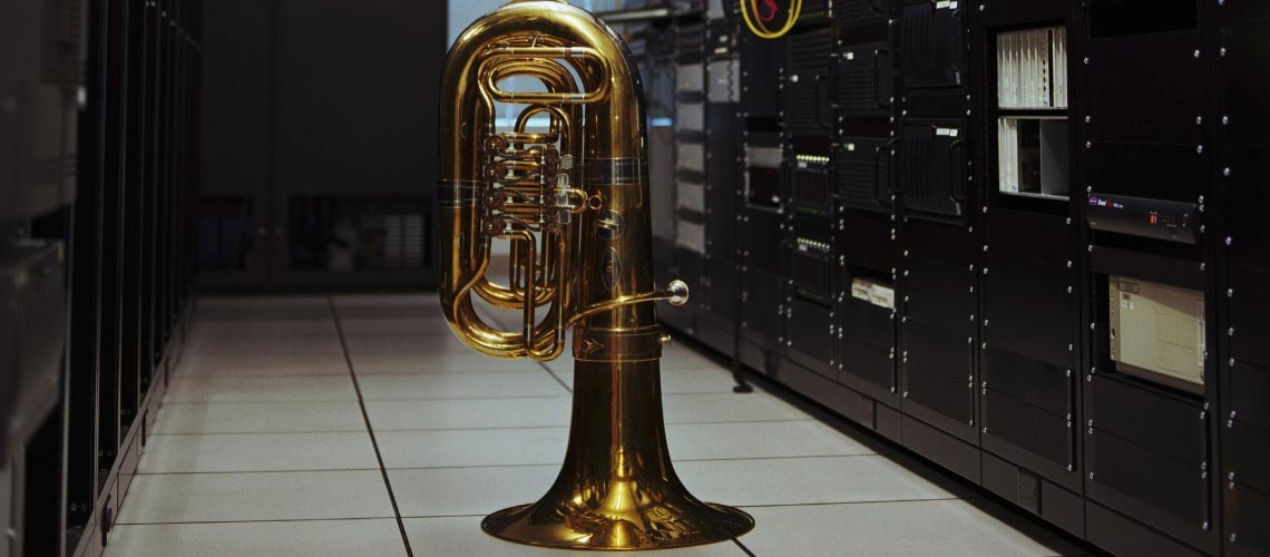 Photo of a tuba on the ground of some archives.