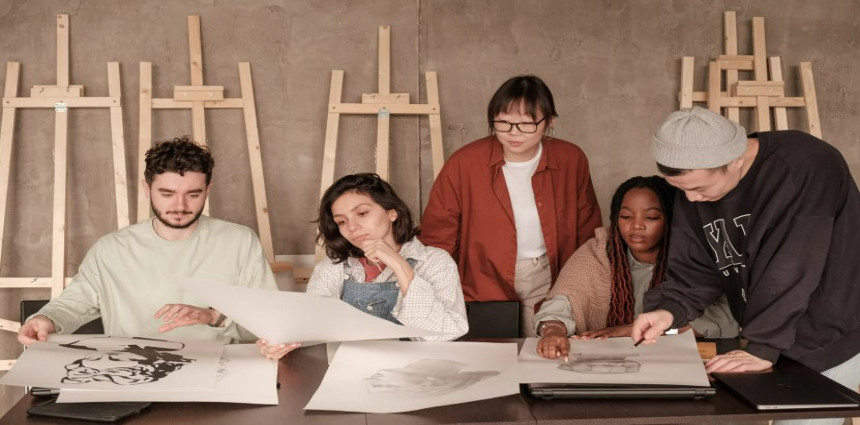 People drawing at a table