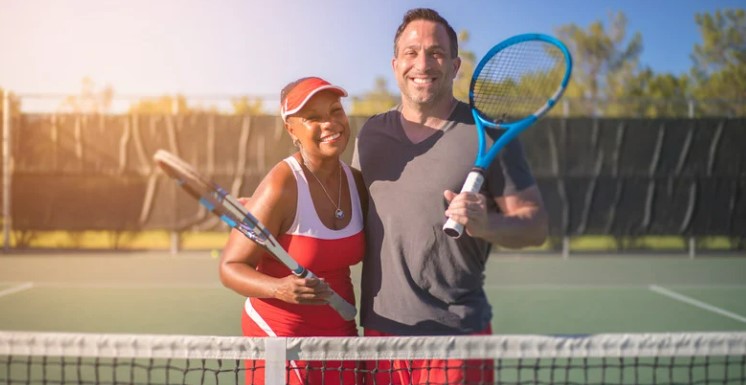 people on tennis court outdoors