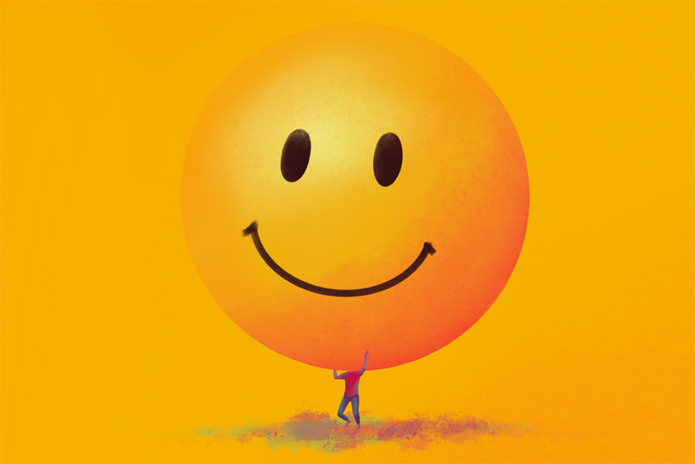 An illustration of a person holding up a large smiley face.