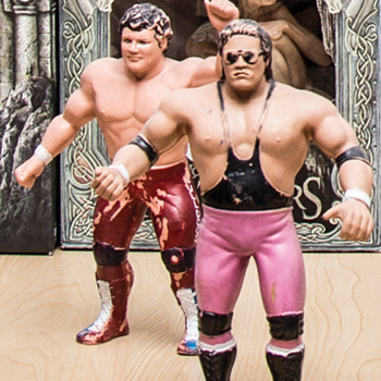 Two worn WWE wresting figurines