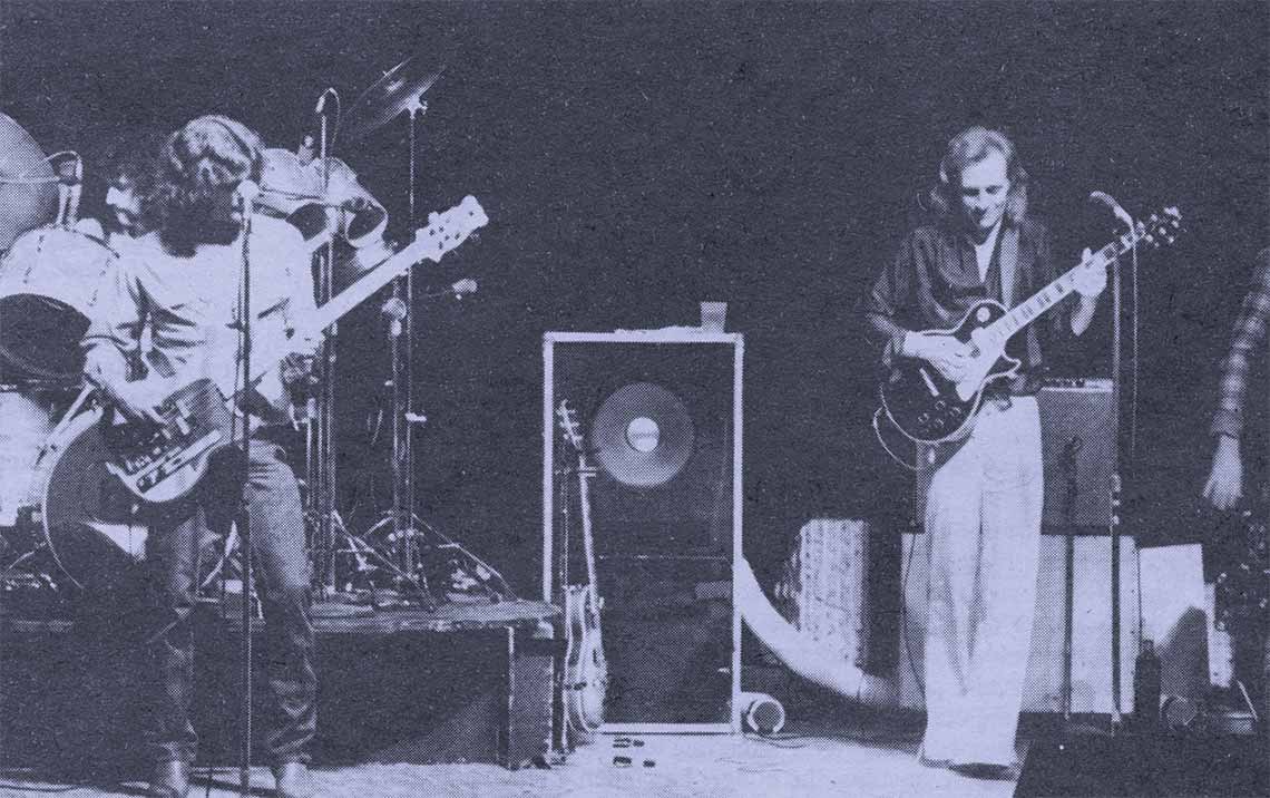 Historic photo of the band Fosterchild playing at the Forum with a purple half-tone treatment applied.
