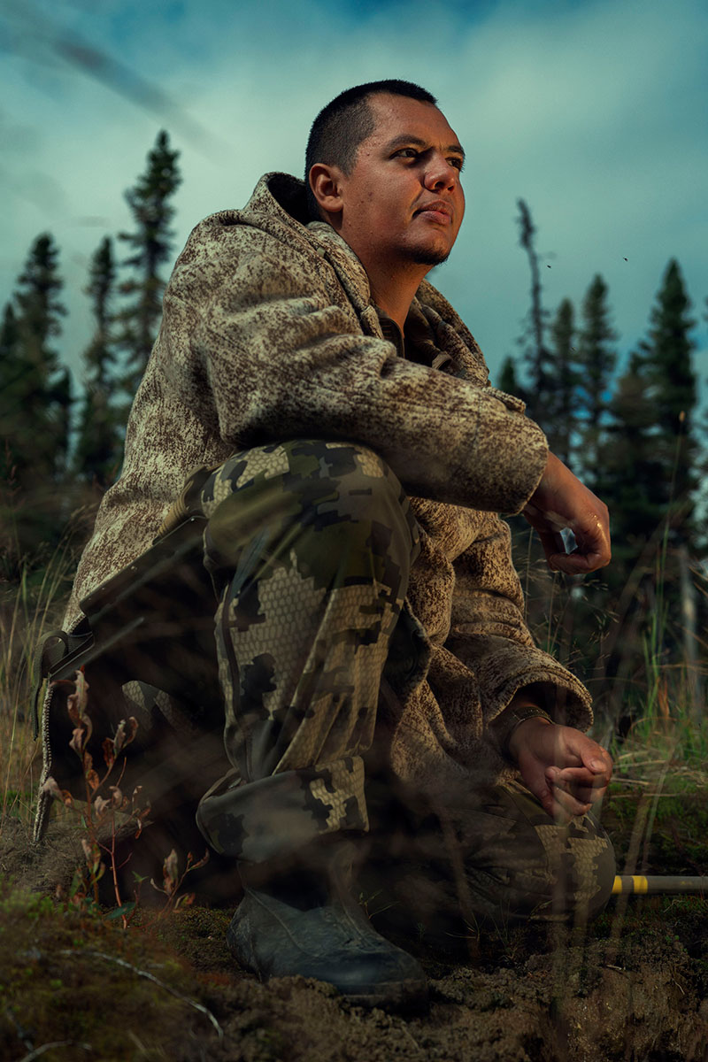 Juan Pablo Quiñonez kneeling in the outdoors