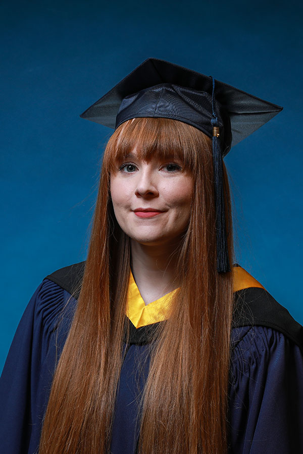 Emily Trew in graduation regalia