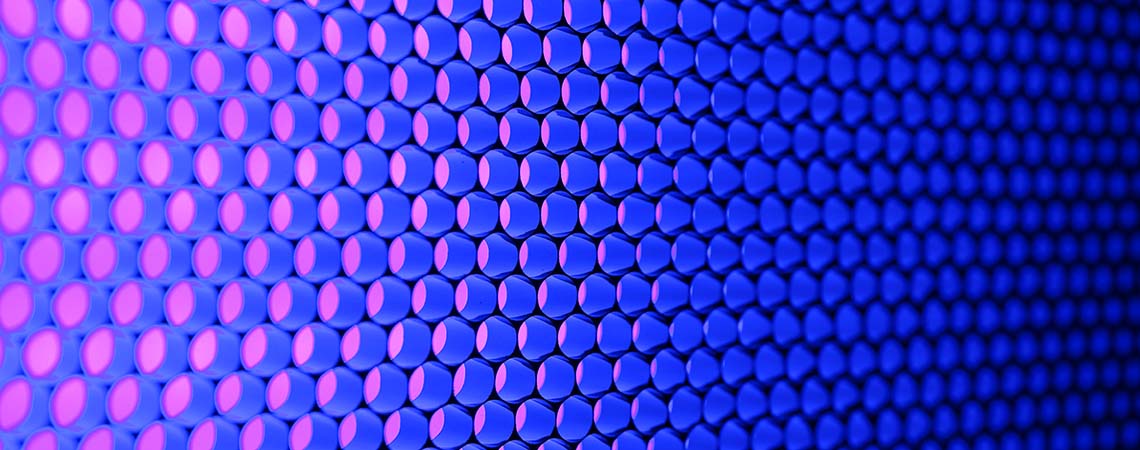 Close up of an RGB display with blue and purple light.