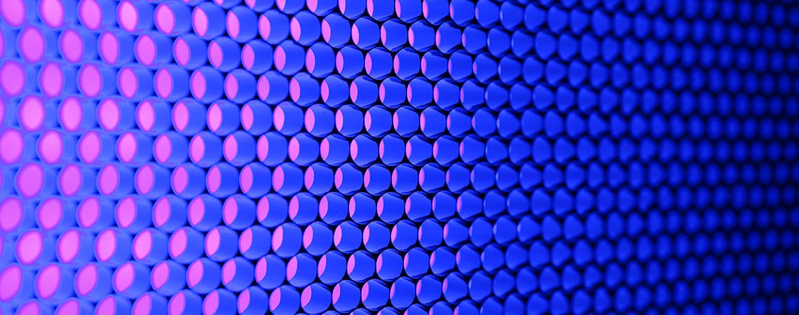 Close up of an RGB display with blue and purple light.