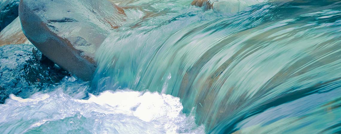 Image of a shallow waterfall in a river.