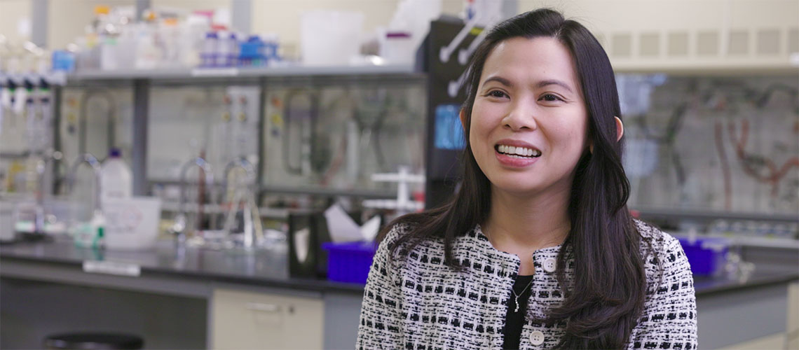 Dr. Jeela Acedo, PhD in a lab at Mount Royal University
