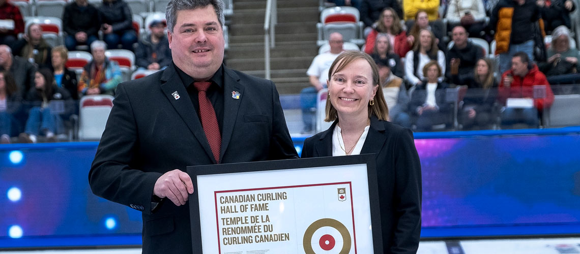 Michael Szajewski, left, Chair of the Curling Canada Board of Governors, and University Secretary Amy Nixon. Photo courtesy Curling Canada/Andrew Klaver.