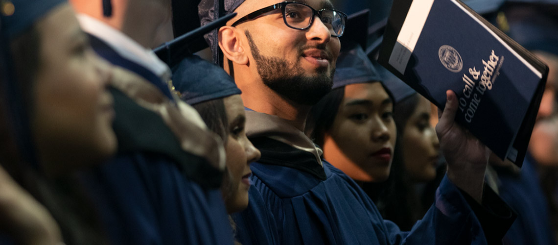 MRU graduates in caps and gowns.