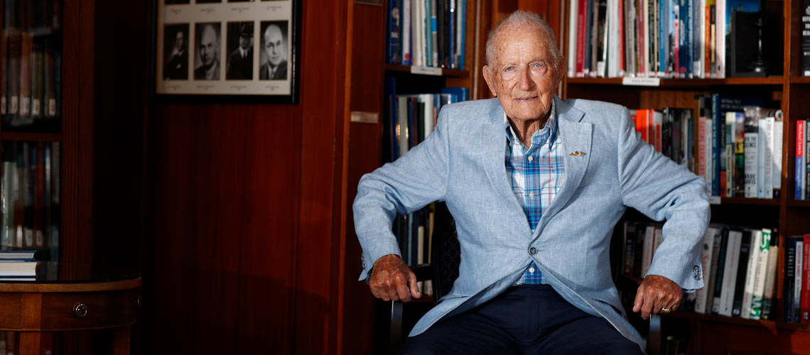 Ken Lett sitting in his home library.