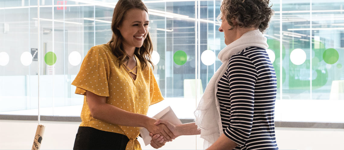 Shaelynn Zouboules shaking hands with Meagan Bowler.