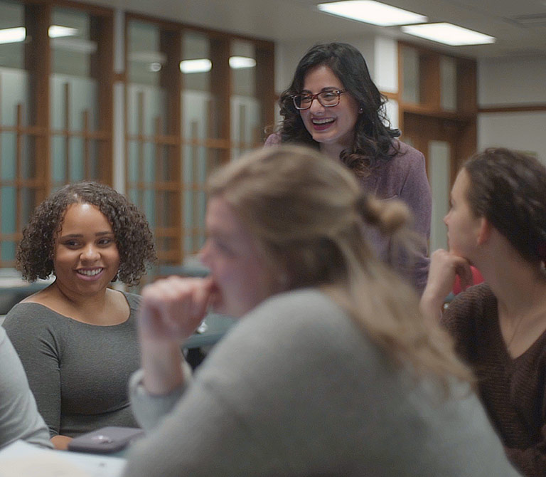 Professor Aliyah Dosani, PhD, taching in a classroom full of students